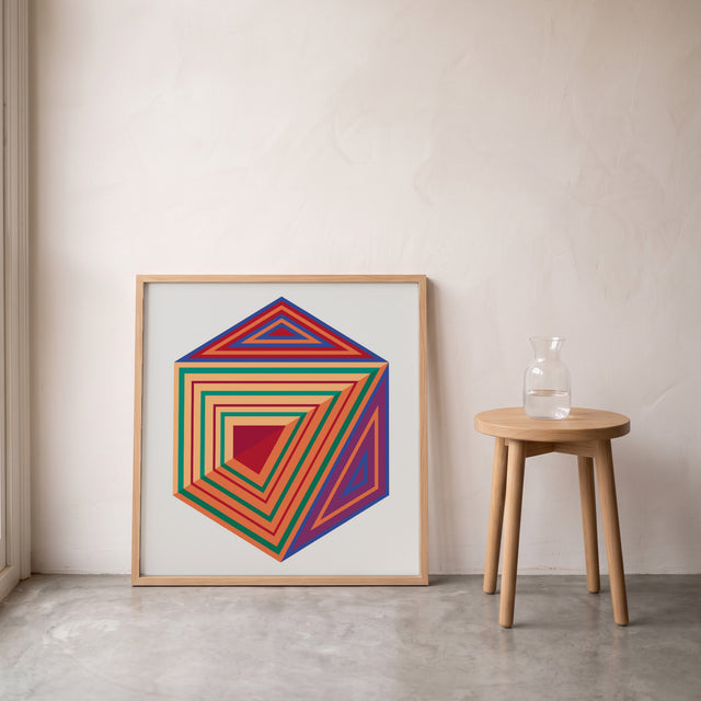 Hexa 7 framed leaning against the wall on a concrete floor – art print by Marcio Pontes