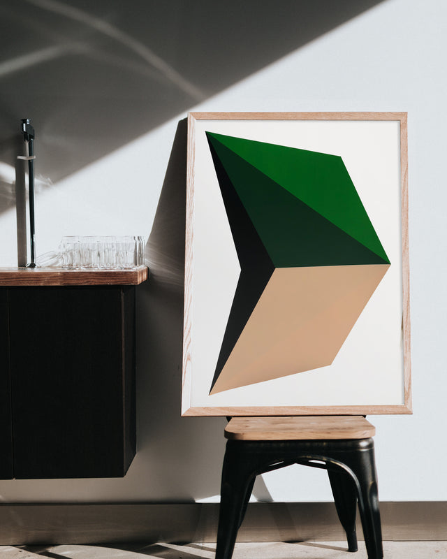 Framed handmade silkscreen print designed with large graphics in dark green, black and soft sand colors