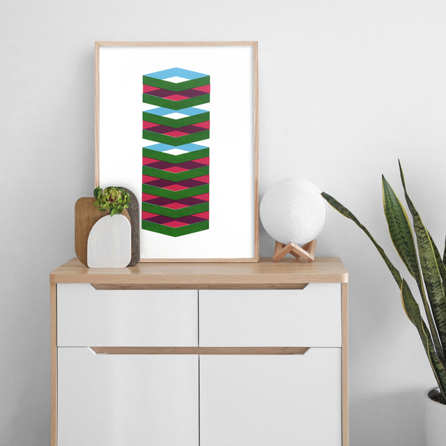 Spring Blue – blue and magenta cube screen print by Marcio Pontes, displayed on a wall