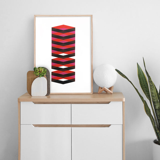 Spring Black and Red – black and red cube screen print by Marcio Pontes, displayed on a wall
