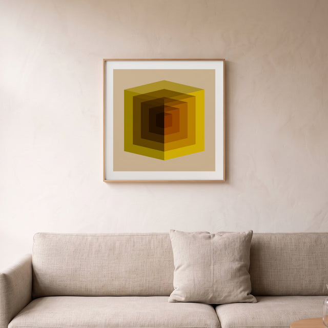Cube Full Yellow framed above a linen sofa – art print by Marcio Pontes