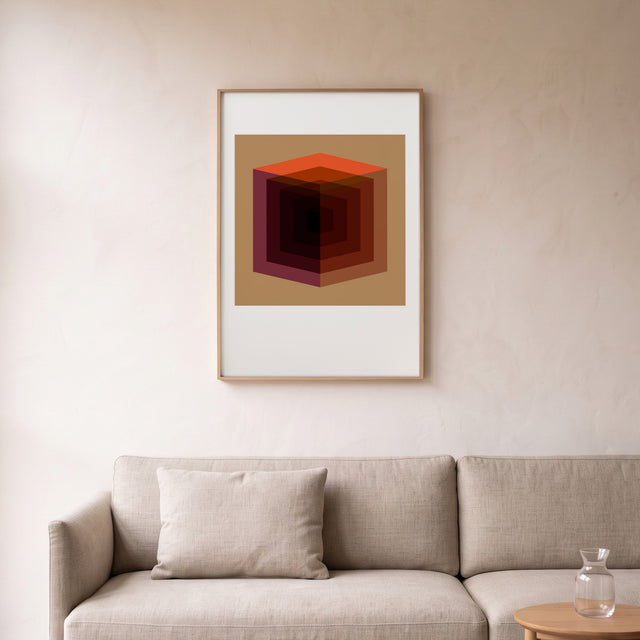 Cube Full Orange framed above a linen sofa – art print by Marcio Pontes
