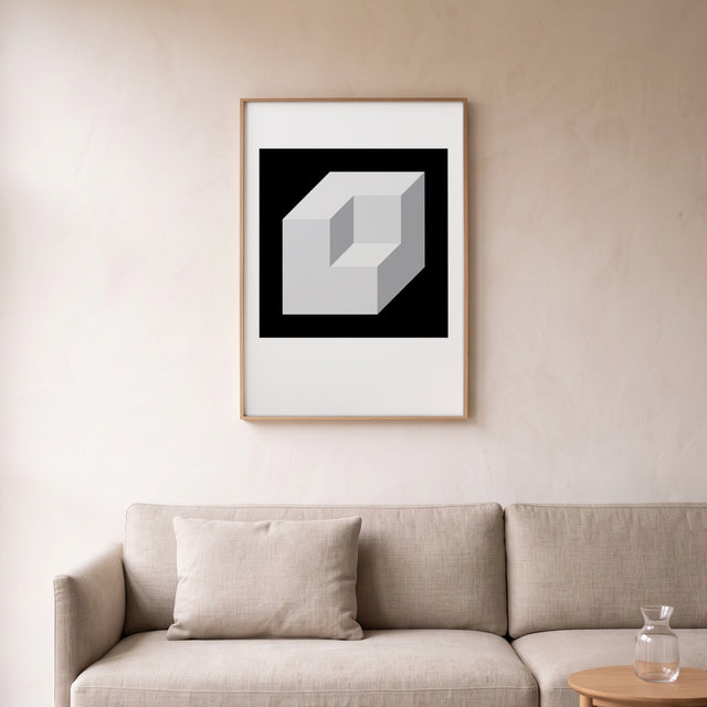 Cube Sliding II framed above a linen sofa – art print by Marcio Pontes