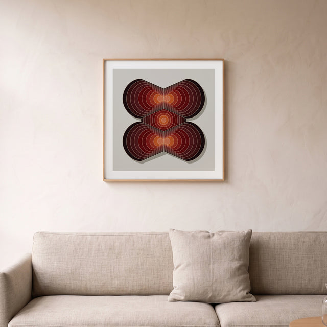 Layers Red I framed above a linen sofa – art print by Marcio Pontes