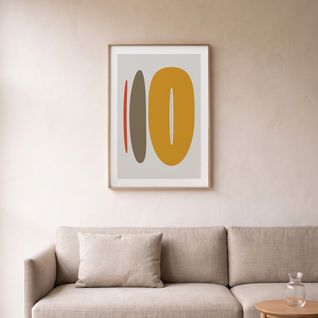 Stones II framed above a linen sofa – art print by Marcio Pontes