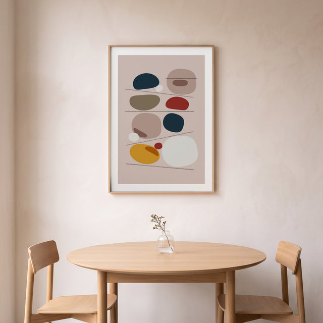 Stones IV framed above a round oak dining table – art print by Marcio Pontes