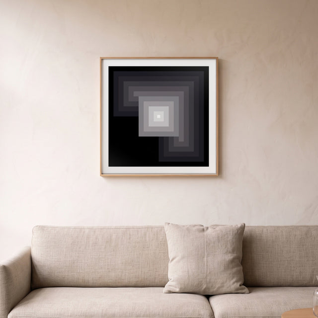 Minimal Black framed above a linen sofa – art print by Marcio Pontes