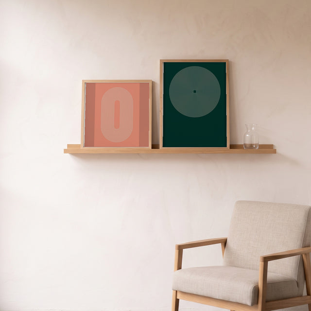 Kundaline Anahata framed on an oak picture shelf beside a linen armchair – art print by Marcio Pontes