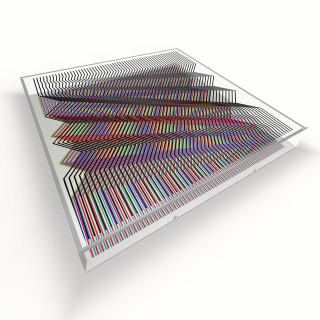Op Zig Line lying flat, seen from above – rainbow and white geometric optical acrylic artwork by Marcio Pontes