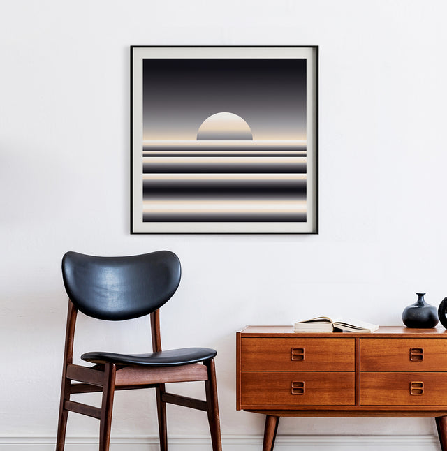 Retrocosmos Lunar 2 framed on a white wall above a teak sideboard and black chair – black and cream art print by Marcio Pontes