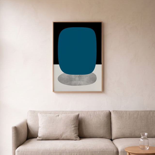 Stones Black framed above a linen sofa – art print by Marcio Pontes