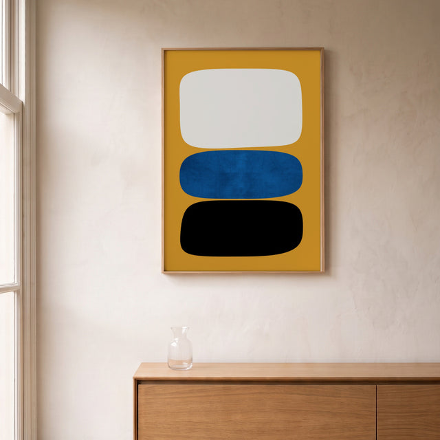 Stones Yellow framed above an oak sideboard by a canal-view window – art print by Marcio Pontes