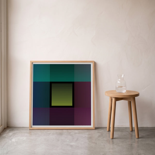 Underline 16 framed leaning against the wall on a concrete floor – art print by Marcio Pontes