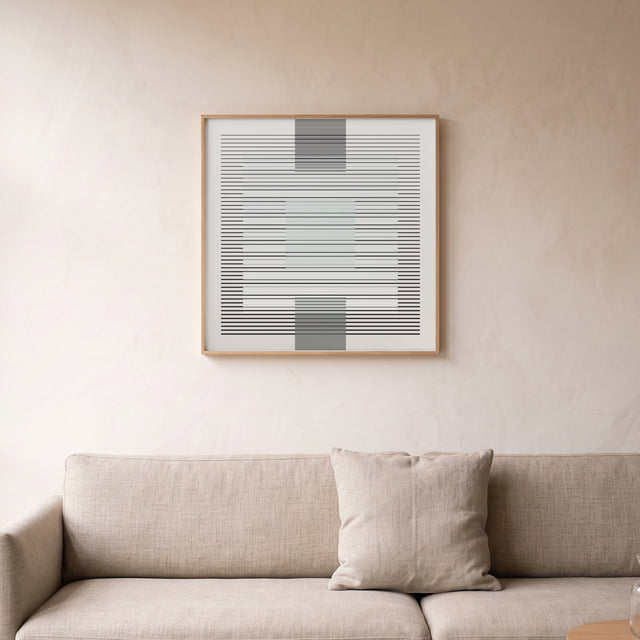 Underline White framed above a linen sofa – art print by Marcio Pontes